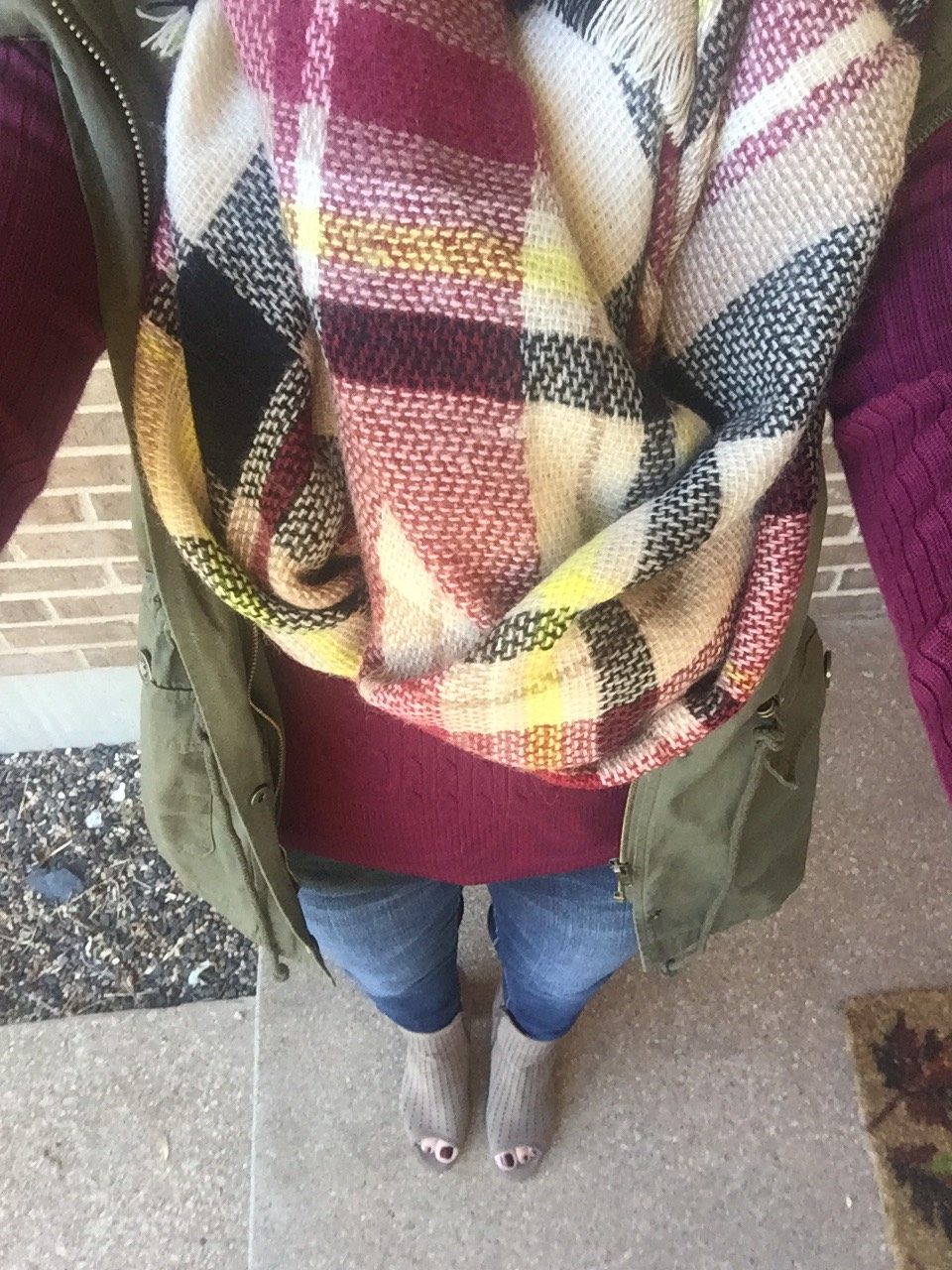 Plaid Blanket Scarf with maroon shirt. 
