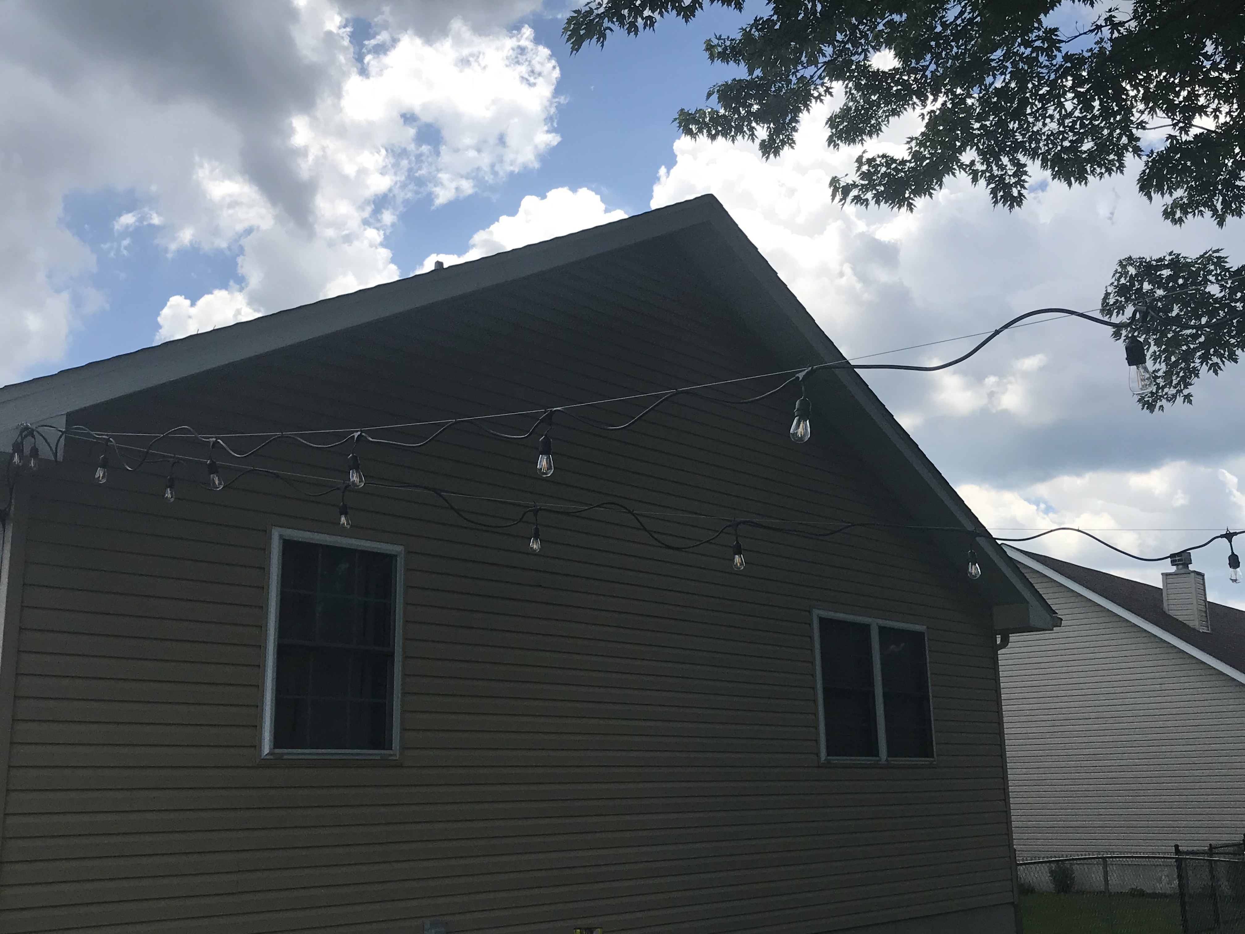 How to hang outdoor string lights. Easy backyard DIY ideas.