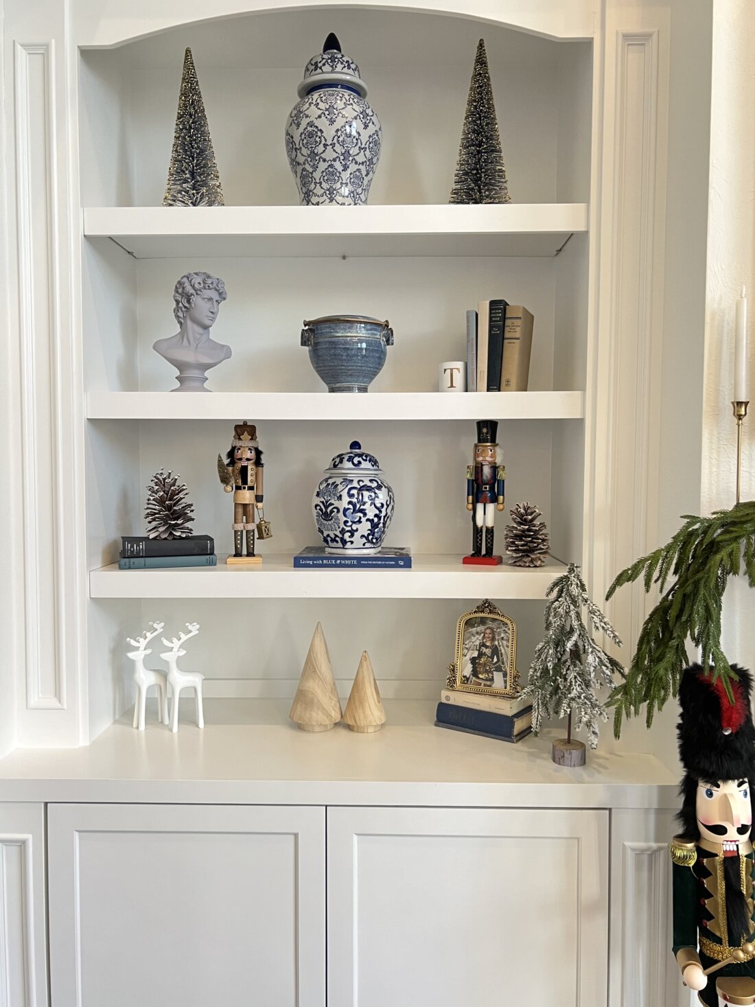 Blue and white decor for bookshelf